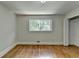 Bedroom featuring hardwood floors, window, and closet at 4253 Smithsonia Dr, Tucker, GA 30084