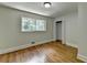 Bedroom featuring hardwood floors, window, and closet at 4253 Smithsonia Dr, Tucker, GA 30084