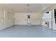 Spacious attached carport showing painted floor, brick foundation, and side window for natural light at 4253 Smithsonia Dr, Tucker, GA 30084