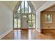 Inviting foyer with high ceilings, glass inserts, and hardwood floors at 4253 Smithsonia Dr, Tucker, GA 30084