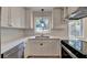 Modern kitchen featuring stainless steel appliances, white cabinets, and sleek countertops at 4253 Smithsonia Dr, Tucker, GA 30084