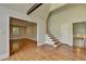 Bright living room featuring hardwood floors and open entryways at 4253 Smithsonia Dr, Tucker, GA 30084