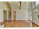 Bright living room with hardwood floors and a clear view of the entryway, featuring a staircase at 4253 Smithsonia Dr, Tucker, GA 30084