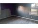 Partially painted bedroom with stylish flooring and natural light from the window at 6258 Mount Zion Blvd, Morrow, GA 30260
