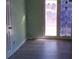 Bright bedroom with a new floor and natural light coming from the large door at 6258 Mount Zion Blvd, Morrow, GA 30260