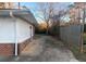 Long driveway leading to the backyard, with a fenced-in yard at 6258 Mount Zion Blvd, Morrow, GA 30260
