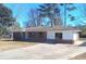 Charming single-story brick home with a spacious driveway and well-maintained lawn at 6258 Mount Zion Blvd, Morrow, GA 30260