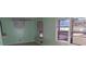 Bright living room featuring fresh mint paint, and natural light from multiple windows at 6258 Mount Zion Blvd, Morrow, GA 30260