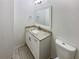 Updated bathroom features granite countertop, white cabinets, and updated fixtures at 6420 Wedgeview Dr, Tucker, GA 30084