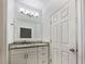 Bathroom featuring granite countertops, modern fixtures, and vanity at 6420 Wedgeview Dr, Tucker, GA 30084