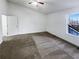 Bright bedroom with neutral carpet, ceiling fan, and ample closet space at 6420 Wedgeview Dr, Tucker, GA 30084