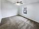 Minimal bedroom features neutral carpet, a large window, and natural light at 6420 Wedgeview Dr, Tucker, GA 30084