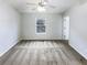 Bedroom featuring a ceiling fan and large window for natural light at 6420 Wedgeview Dr, Tucker, GA 30084