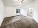 Large bedroom with neutral carpet and ample natural light at 6420 Wedgeview Dr, Tucker, GA 30084
