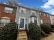 Charming two-story home with a blue front door and manicured landscaping at 6420 Wedgeview Dr, Tucker, GA 30084