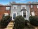 Charming townhome with light blue siding, well maintained landscaping, and inviting front entrance at 6420 Wedgeview Dr, Tucker, GA 30084