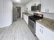 Well-equipped kitchen with stainless steel appliances and granite countertops at 6420 Wedgeview Dr, Tucker, GA 30084