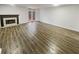 Spacious living room boasts sleek wood floors and natural light from the back door at 6420 Wedgeview Dr, Tucker, GA 30084