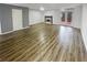 Open living space with vinyl floors, a fireplace, and access to the patio at 6420 Wedgeview Dr, Tucker, GA 30084