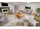 Bright living room featuring modern furniture, a fireplace, and access to an outdoor area at 6420 Wedgeview Dr, Tucker, GA 30084
