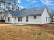 View of the backyard featuring a patio and white siding of a single story home at 781 Courthouse Park Dr, Temple, GA 30179