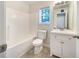 Bright bathroom with vanity, a window for natural light, toilet, and a shower and tub combination at 781 Courthouse Park Dr, Temple, GA 30179