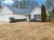 Beautiful home with two-car garage and lovely landscaping, set on a well-manicured lot at 781 Courthouse Park Dr, Temple, GA 30179