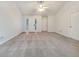 Open living room with neutral walls, plush carpeting and bright light at 781 Courthouse Park Dr, Temple, GA 30179