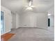 Open living room with neutral walls and carpet at 781 Courthouse Park Dr, Temple, GA 30179