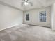 Spacious main bedroom with tray ceiling, ceiling fan, and carpet flooring at 781 Courthouse Park Dr, Temple, GA 30179