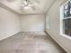 Large main bedroom featuring a tray ceiling and two windows providing natural light at 781 Courthouse Park Dr, Temple, GA 30179