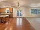 Open kitchen with island and stainless appliances flows into bright living area at 1340 Apple Blossom Dr, Cumming, GA 30041