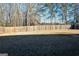 Large, fenced backyard providing privacy and security, perfect for outdoor activities at 165 Ruby Ln, Mcdonough, GA 30252