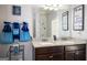 Well-lit bathroom boasting dual sinks with decorative granite countertops, matching fixtures and decor at 165 Ruby Ln, Mcdonough, GA 30252