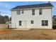 Back exterior of home, showing patio, siding and windows at 166 Floresta Dr, Mcdonough, GA 30252