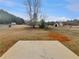 Sprawling backyard features a concrete patio and a large grassy lawn at 166 Floresta Dr, Mcdonough, GA 30252