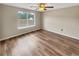 Bedroom with hard wood floors, tan walls and a window at 166 Floresta Dr, Mcdonough, GA 30252