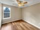 Bedroom with hard wood floors, tan walls and a ceiling fan at 166 Floresta Dr, Mcdonough, GA 30252