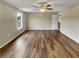 An ample sized bedroom featuring hardwood floors, natural light and a walk-in closet at 166 Floresta Dr, Mcdonough, GA 30252