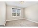 This bedroom has carpet, white walls and a window for natural light at 3137 Primrose St, Douglasville, GA 30135