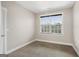 This bedroom has carpet, white walls and a window for natural light at 3137 Primrose St, Douglasville, GA 30135