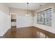 Bright dining room featuring hardwood floors, wainscoting, and a large window for natural light at 3137 Primrose St, Douglasville, GA 30135