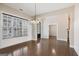 Spacious dining room with hardwood floors, a chandelier, and views into other living spaces at 3137 Primrose St, Douglasville, GA 30135