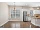 Bright eat-in kitchen featuring stainless steel appliances and hardwood floors at 3137 Primrose St, Douglasville, GA 30135