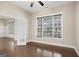 Bright living room with hardwood floors, a ceiling fan, and an open doorway to another room at 3137 Primrose St, Douglasville, GA 30135