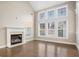 Elegant living room with a fireplace, tall ceilings, and large windows offering ample natural light at 3137 Primrose St, Douglasville, GA 30135