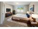 Staged bedroom with modern furniture, accent rug, and natural light at 3308 Steeple Chase Sw Way, Conyers, GA 30094