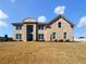 Stately two-story brick home with arched entryway and manicured front lawn at 3308 Steeple Chase Sw Way, Conyers, GA 30094