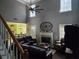 Inviting living room with a fireplace, high ceilings, and ample natural light from the windows at 3578 Willow Spring Ct, Decatur, GA 30034