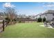 Large backyard with a lush green lawn, privacy fence and patio with furniture at 4080 Huron Dr, Cumming, GA 30028